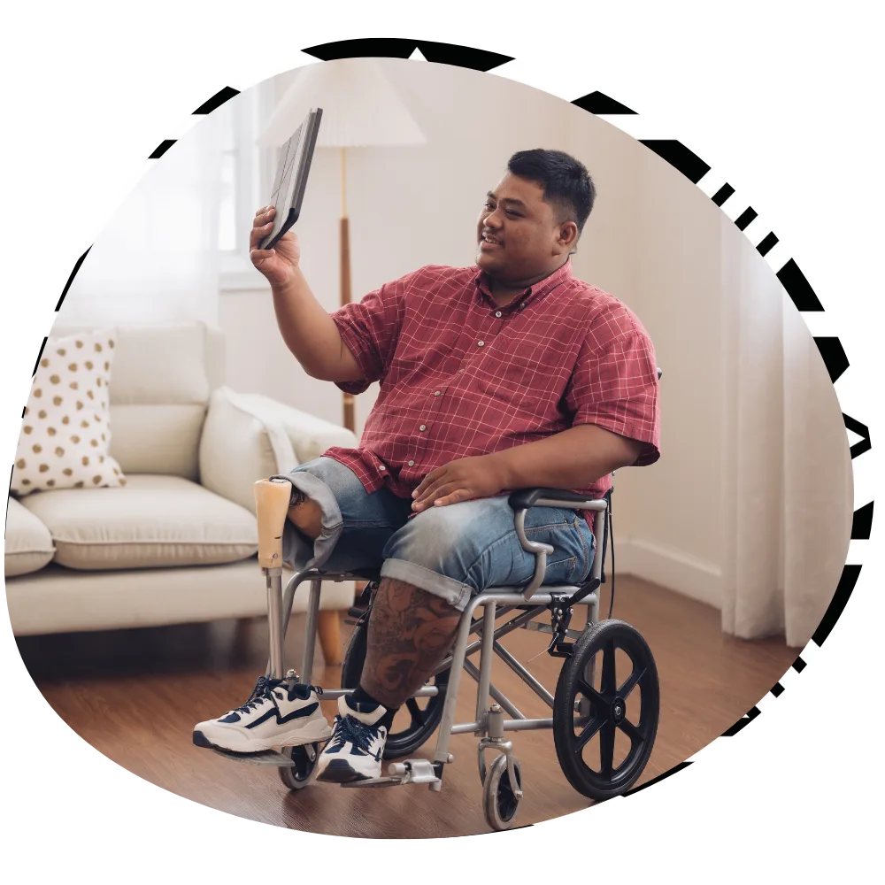 Disabled man in wheelchair on video call